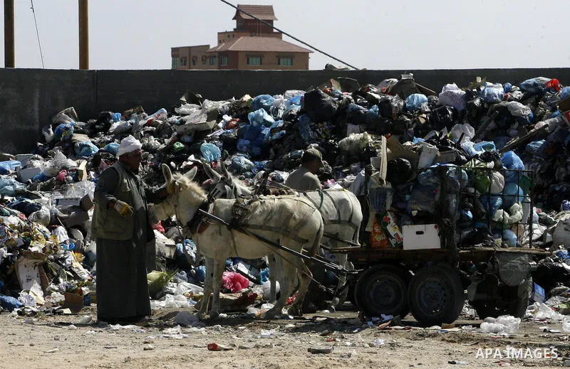 Palestinians collect rubbish to production compost in station in Rafah in the southern Gaza Strip, on Sep. 23, 2012 Some Palestinians, driven by poverty exacerbated by the Israeli blockade and lack of employment opportun...