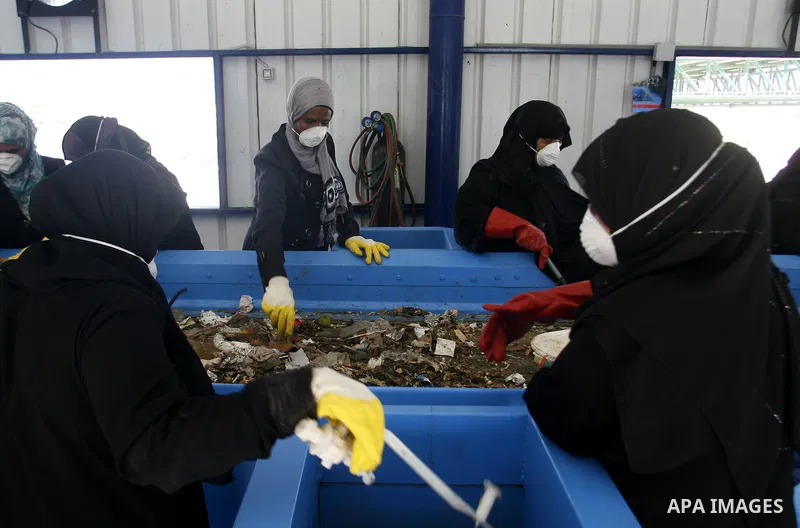 Palestinian women sort solid waste for production compost in station in Rafah in the southern Gaza Strip, on Sep. 23, 2012 Some Palestinians, driven by poverty exacerbated by the Israeli blockade and lack of employment o...
