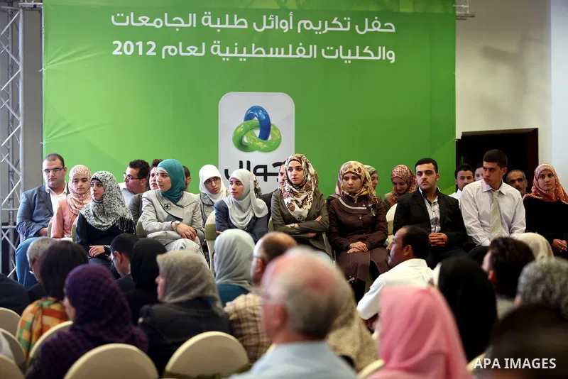 Palestinian Prime Minister Salam Fayyad (not seen) speaks during the ceremony of the honoring the superior students in the Palestinian Universities in the year 2012, in the West Bank city of Ramallah, Sept. 23, 2012. Pho...