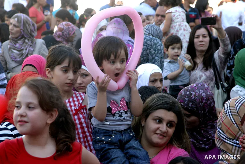 Palestinian children attend the Jerusalemite cakes festival in al-Sheikh Jarrah neighborhood in the east of Jerusalem city, on 23 September 2012. Photo by Mahfouz Abu Turk