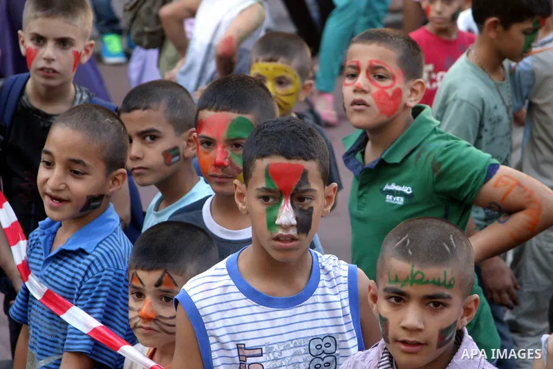 Palestinian children attend the Jerusalemite cakes festival in al-Sheikh Jarrah neighborhood in the east of Jerusalem city, on 23 September 2012. Photo by Mahfouz Abu Turk