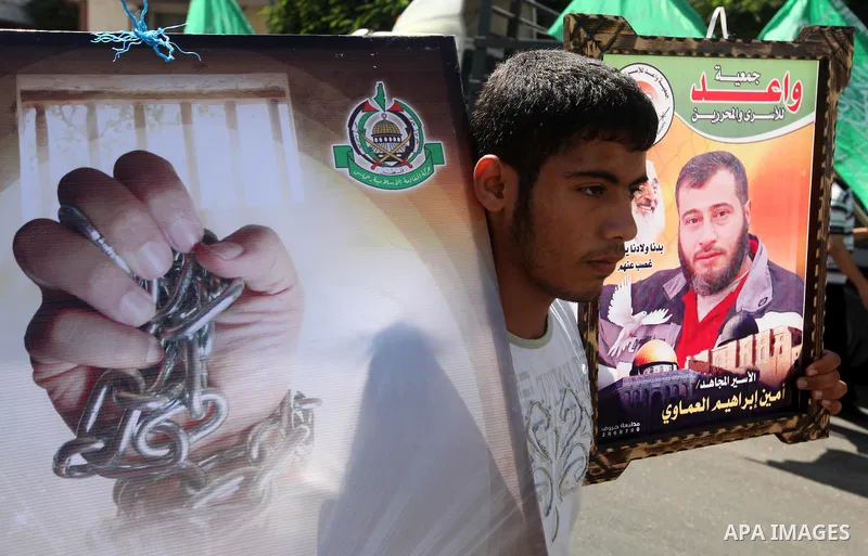 Palestinians take part in a protest in Gaza City calling for the release of Palestinian prisoners from Israeli jails September 24, 2012. Photo by Majdi Fathi