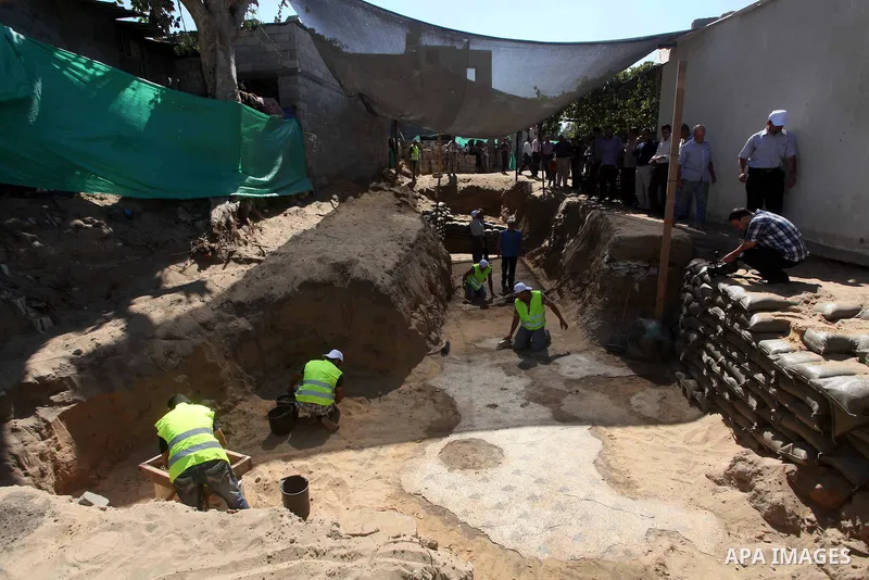 Palestinian employees work at the new archaeological site in Beit Lahia northern Gaza Strip on September 24, 2012. The French government is financing the restoration of the archaeological site which dates back to 329 AD...