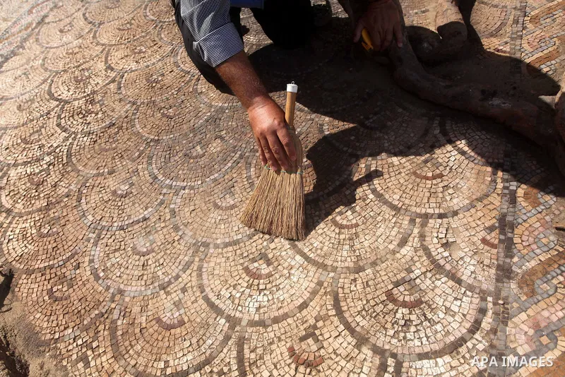 Palestinian employees work at the new archaeological site in Beit Lahia northern Gaza Strip on September 24, 2012. The French government is financing the restoration of the archaeological site which dates back to 329 AD...
