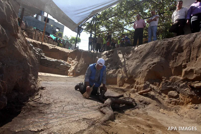 Palestinian employees work at the new archaeological site in Beit Lahia northern Gaza Strip on September 24, 2012. The French government is financing the restoration of the archaeological site which dates back to 329 AD...