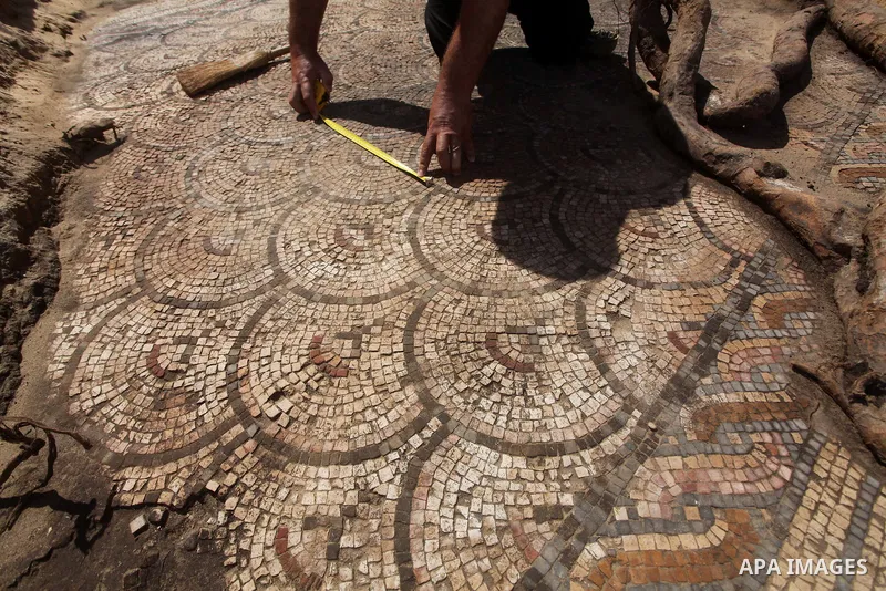 Palestinian employees work at the new archaeological site in Beit Lahia northern Gaza Strip on September 24, 2012. The French government is financing the restoration of the archaeological site which dates back to 329 AD...