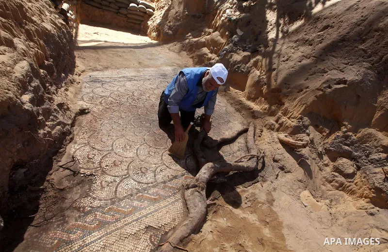 Palestinian employees work at the new archaeological site in Beit Lahia northern Gaza Strip on September 24, 2012. The French government is financing the restoration of the archaeological site which dates back to 329 AD...
