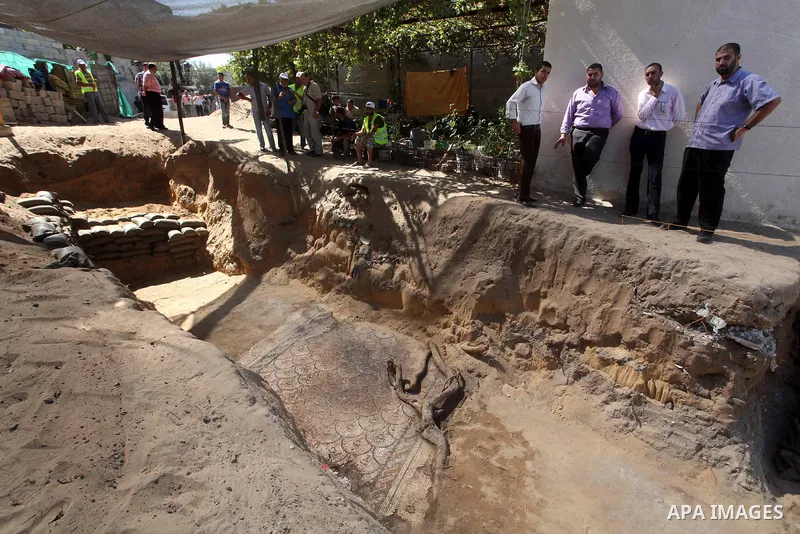 Palestinian employees work at the new archaeological site in Beit Lahia northern Gaza Strip on September 24, 2012. The French government is financing the restoration of the archaeological site which dates back to 329 AD...