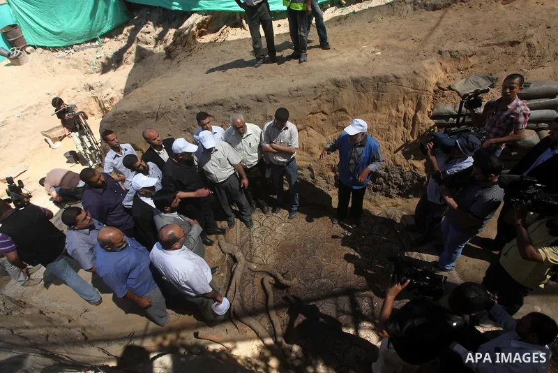 Palestinian employees work at the new archaeological site in Beit Lahia northern Gaza Strip on September 24, 2012. The French government is financing the restoration of the archaeological site which dates back to 329 AD...