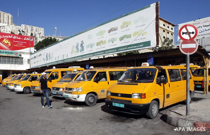 Palestinian taxi drivers park their cars during a protest against rising fuel prices and the high cost of living, in the West Bank city of Nablus, Sept. 24, 2012. Photo by Nedal Eshtayah