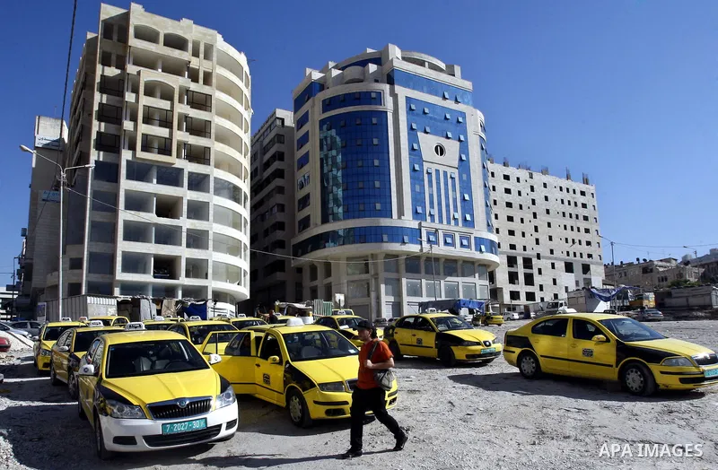 Palestinian taxi drivers park their cars during a protest against rising fuel prices and the high cost of living, in the West Bank city of Nablus, Sept. 24, 2012. Photo by Nedal Eshtayah