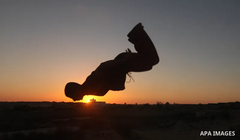 Palestinian youths practice their parkour skills in Khan Younis in southern Gaza Strip on 24 September 2012. Parkour originating in France is the physical practice of traversing elements in both urban and rural settings...