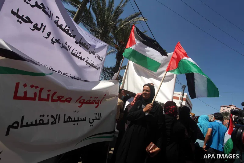 Palestinian women attend a protest calling for an end to Palestinian divisions between Fatah and Hamas, in Gaza city, on Sep. 25, 2012. Photo by Ashraf Amra