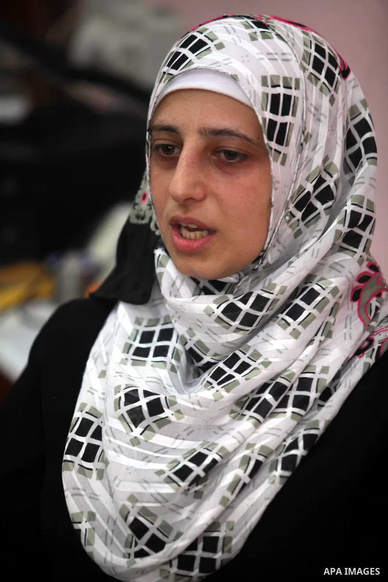 Palestinian Fatma al-Halouli stands at her cell phones shop in Gaza city on 25 September 2012. The International Monetary Fund (IMF) noted that growth has slowed and unemployment risen in both the West Bank and the Gaza...