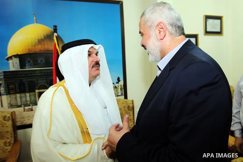 Palestinian Prime Minister in Gaza Ismail Haniyeh meet with the Qatari delegation to discuss how to rebuild the Gaza Strip, after the Israeli war in 2008 on the Gaza Strip, on September 25, 2012. Photo by Ahmed Shaat