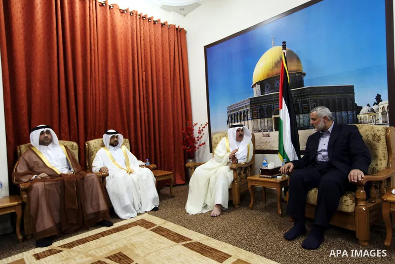 Palestinian Prime Minister in Gaza Ismail Haniyeh meet with the Qatari delegation to discuss how to rebuild the Gaza Strip, after the Israeli war in 2008 on the Gaza Strip, on September 25, 2012. Photo by Ahmed Shaat