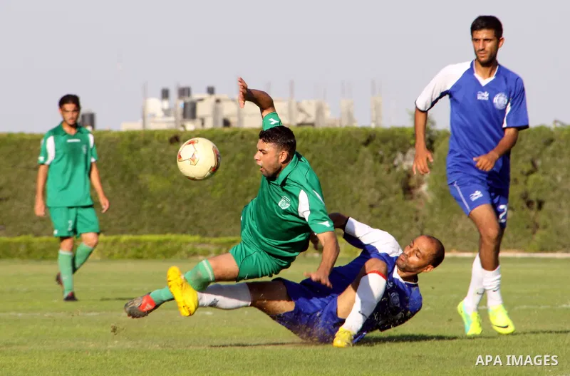 The Palestinian team of al-Shatie and the team of al-Shijaia during the premier league soccer match in Gaza city on 23 September 2012. Photo by Alaa Shamaly