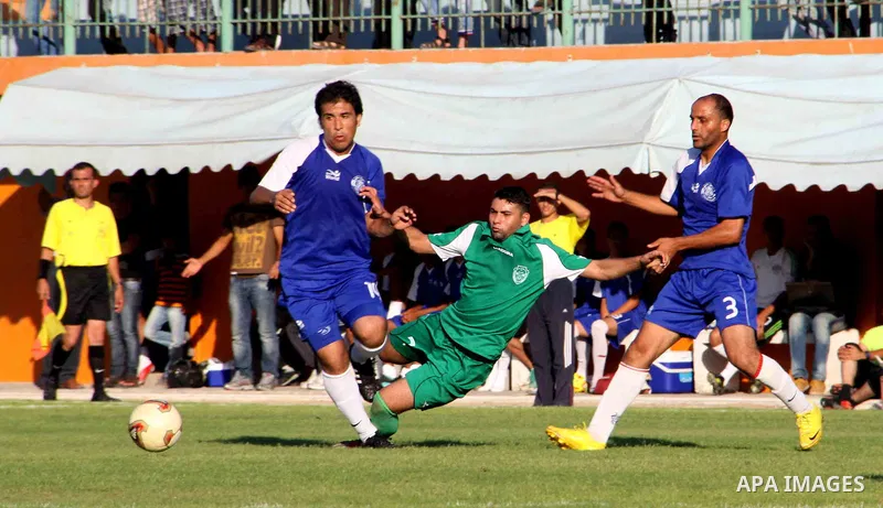 The Palestinian team of al-Shatie and the team of al-Shijaia during the premier league soccer match in Gaza city on 23 September 2012. Photo by Alaa Shamaly