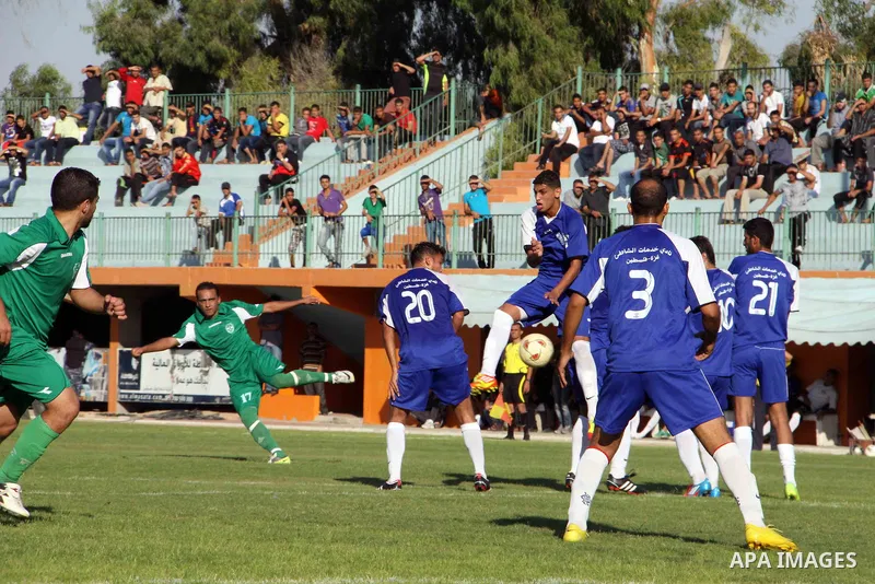 The Palestinian team of al-Shatie and the team of al-Shijaia during the premier league soccer match in Gaza city on 23 September 2012. Photo by Alaa Shamaly