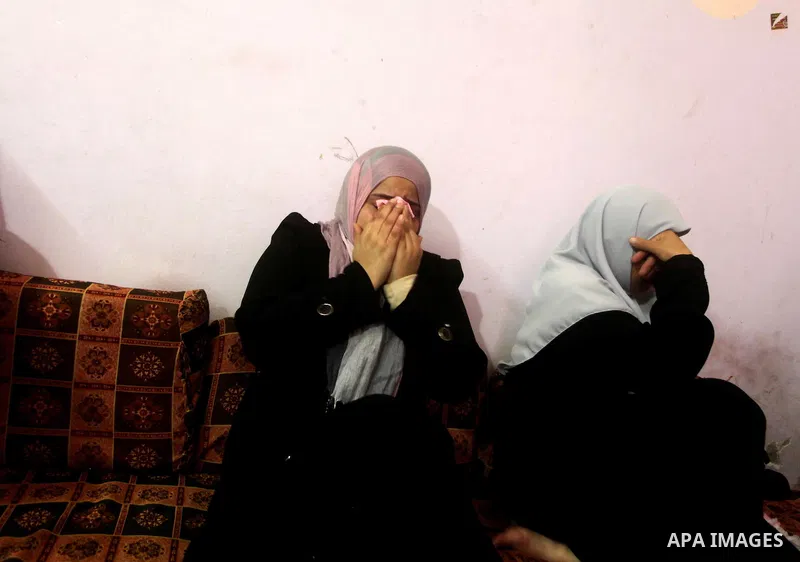 A Palestinian mother of one-year-old Fathi Baghdadi weeps, who died after a fire from a candle that swept through their home in the Bureij refugee camp in the center of the Gaza Strip on September 26, 2012. The Baghdadi...