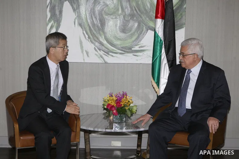 Palestinian President Mahmoud Abbas (Abu Mazen), meets with Japanese envoy to the Middle East Yutaka Oaamora in New York on Sept. 26, 2012. Photo by Thaer Ganaim
