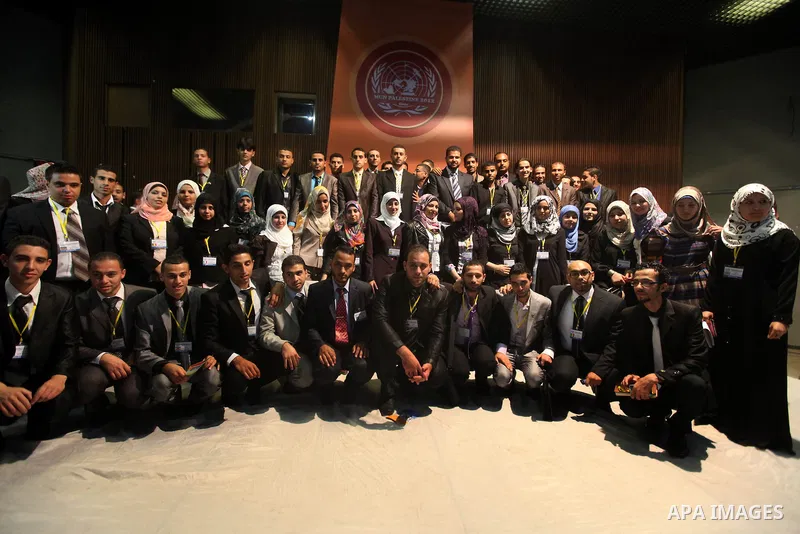 Palestinians attend the opining ceremony of Palestinian Model United Nations (PALMUN) in Gaza city on 27 September 2012 that is organized by the Migratory Letters campaign youth Group along with Gaza Culture and Developm...
