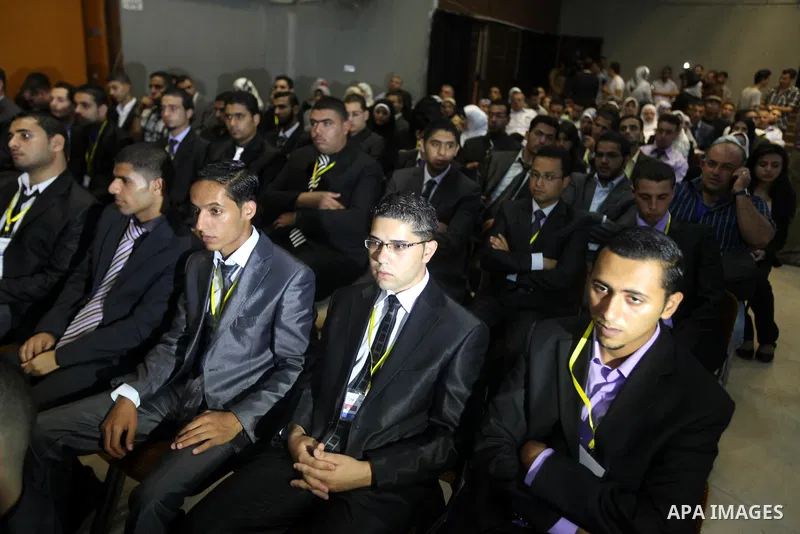 Palestinians attend the opining ceremony of Palestinian Model United Nations (PALMUN) in Gaza city on 27 September 2012 that is organized by the Migratory Letters campaign youth Group along with Gaza Culture and Developm...