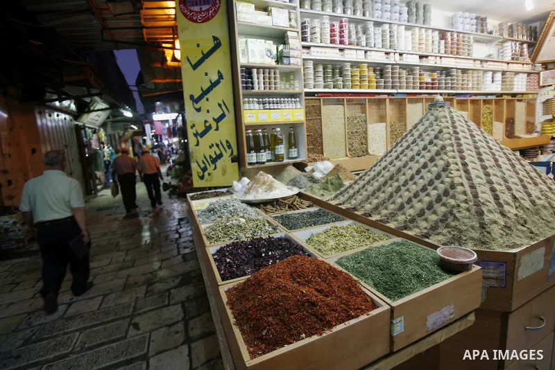Palestinians walk at the market in Jerusalem's old city on 27 September 2012. Photo by Mahfouz Abu Turk