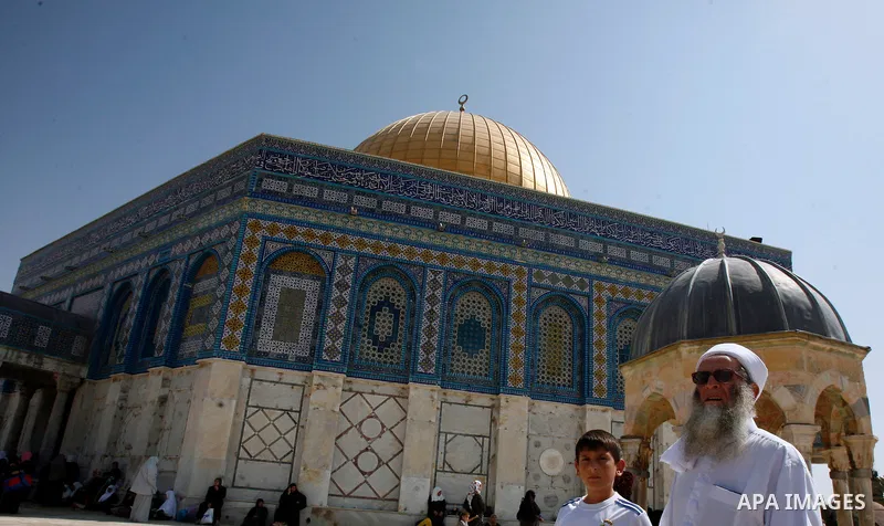 A Palestinan worshiper man walks in front of the Dome of the Rock Mosque during the Friday prayers at al-Aqsa mosque compound in Jerusalem's old city on September 28, 2012. Photo by Mahfouz Abu Turk