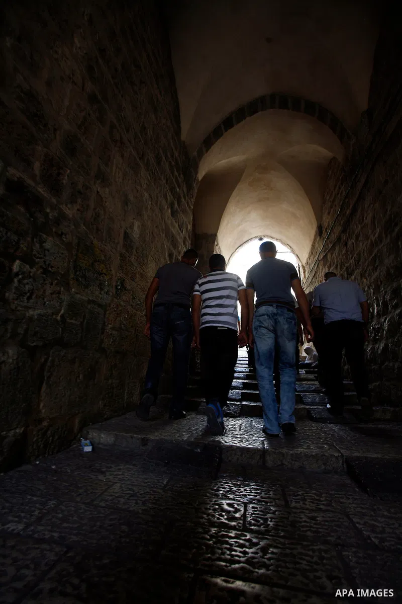 Palestinians walk at the Jerusalem's old city road after the Friday prayers at al-Aqsa mosque compound in Jerusalem's old city on September 28, 2012. Photo by Mahfouz Abu Turk