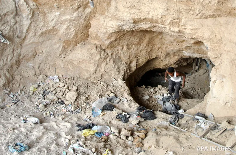 Palestinians work near smuggling tunnels along the border with Egypt in Rafah, southern Gaza Strip, Sunday, Sept. 30, 2012. Hamas officials say that over the past two months, Egypt has closed about 80 percent of the roug...