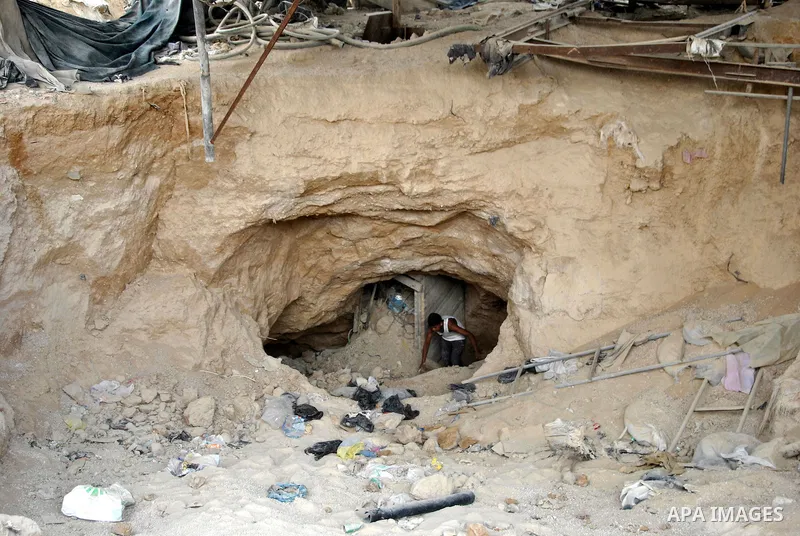 Palestinians work near smuggling tunnels along the border with Egypt in Rafah, southern Gaza Strip, Sunday, Sept. 30, 2012. Hamas officials say that over the past two months, Egypt has closed about 80 percent of the roug...