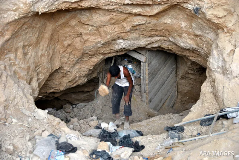 Palestinians work near smuggling tunnels along the border with Egypt in Rafah, southern Gaza Strip, Sunday, Sept. 30, 2012. Hamas officials say that over the past two months, Egypt has closed about 80 percent of the roug...