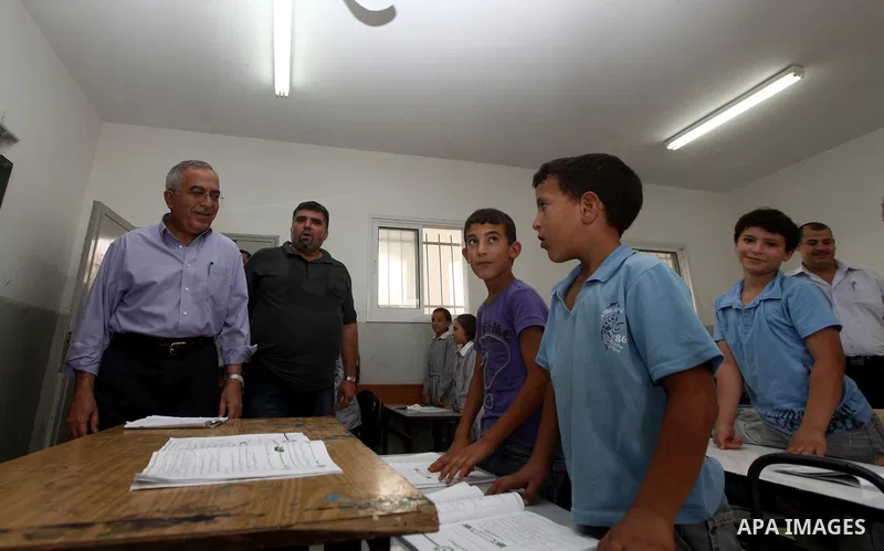 Palestinian Prime Minister Salam Fayyad visits ''al-Auja'' school in the occupied West Bank city of Jericho on September 30, 2012. Photo by Mustafa Abu Dayeh