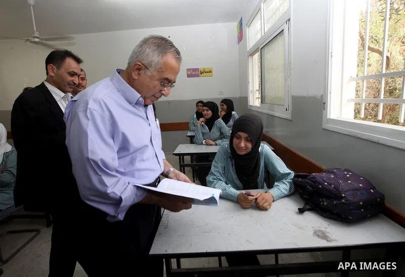 Palestinian Prime Minister Salam Fayyad visits ''al-Auja'' school in the occupied West Bank city of Jericho on September 30, 2012. Photo by Mustafa Abu Dayeh