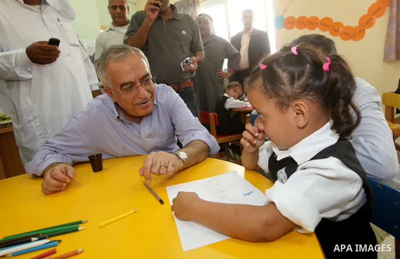 Palestinian Prime Minister Salam Fayyad visits "al-Mustqabal" Kindergarten in Ein al-Sultan refugee camp in the occupied West Bank city of Jericho on September 30, 2012. Photo by Mustafa Abu Dayeh