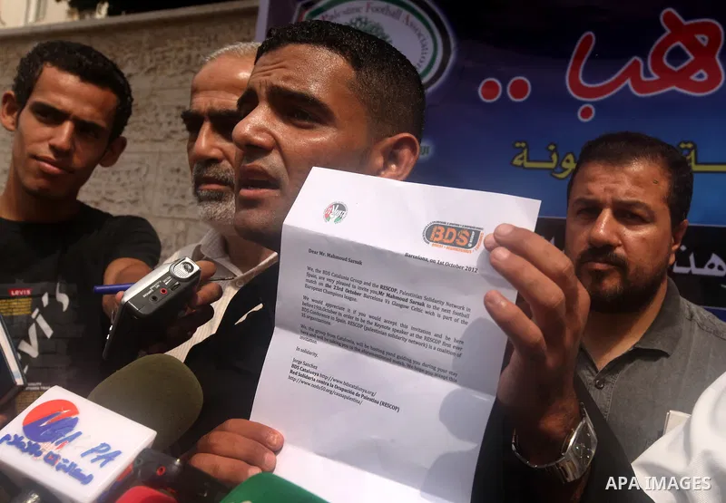 Mahmud Sarsak, Palestinian football player and former prisoner in Israel speaks during a press conference outside the Red Crescent headquarters in Gaza City on October 1, 2012. Sarsak, a former prisoner who went on a hun...