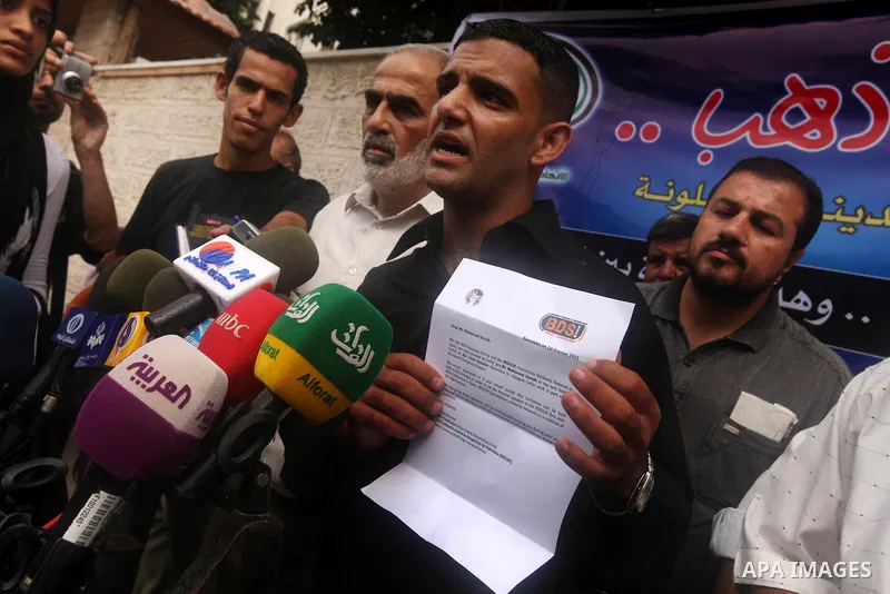 Mahmud Sarsak, Palestinian football player and former prisoner in Israel speaks during a press conference outside the Red Crescent headquarters in Gaza City on October 1, 2012. Sarsak, a former prisoner who went on a hun...