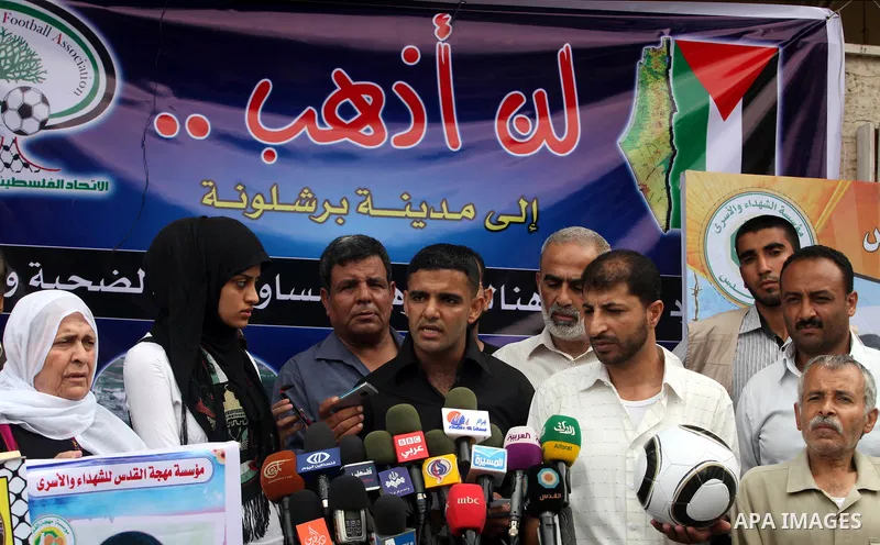 Mahmud Sarsak, Palestinian football player and former prisoner in Israel speaks during a press conference outside the Red Crescent headquarters in Gaza City on October 1, 2012. Sarsak, a former prisoner who went on a hun...