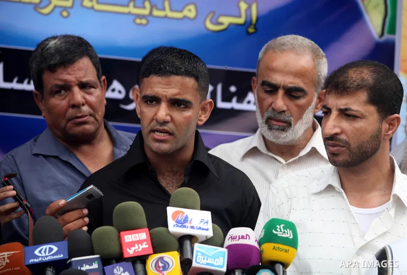 Mahmud Sarsak, Palestinian football player and former prisoner in Israel speaks during a press conference outside the Red Crescent headquarters in Gaza City on October 1, 2012. Sarsak, a former prisoner who went on a hun...