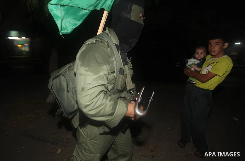 A Palestinian militant of Ezzedine al-Qassam Brigade, the military wing of the Palestinian Islamist movement Hamas which rules Gaza, participates in an anti-Israel military show in Gaza City October 1, 2012. Photo by Maj...