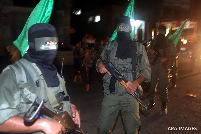 Palestinian militants of Ezzedine al-Qassam Brigade, the military wing of the Palestinian Islamist movement Hamas which rules Gaza, participate in an anti-Israel military show in Gaza City October 1, 2012. Photo by Majdi...