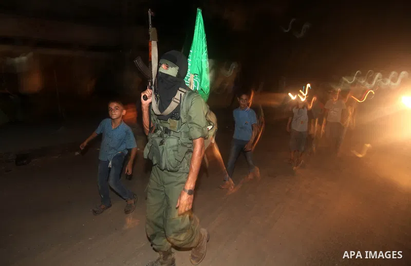 A Palestinian militant of Ezzedine al-Qassam Brigade, the military wing of the Palestinian Islamist movement Hamas which rules Gaza, participates in an anti-Israel military show in Gaza City October 1, 2012. Photo by Maj...