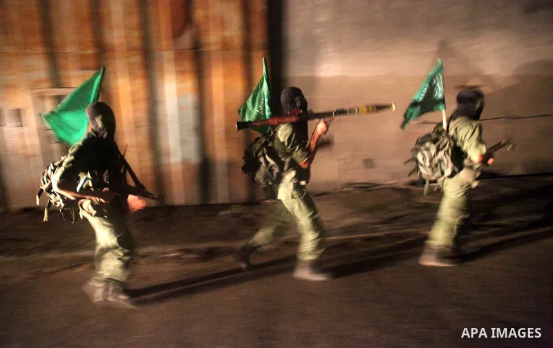 Palestinian militants of Ezzedine al-Qassam Brigade, the military wing of the Palestinian Islamist movement Hamas which rules Gaza, participate in an anti-Israel military show in Gaza City October 1, 2012. Photo by Majdi...