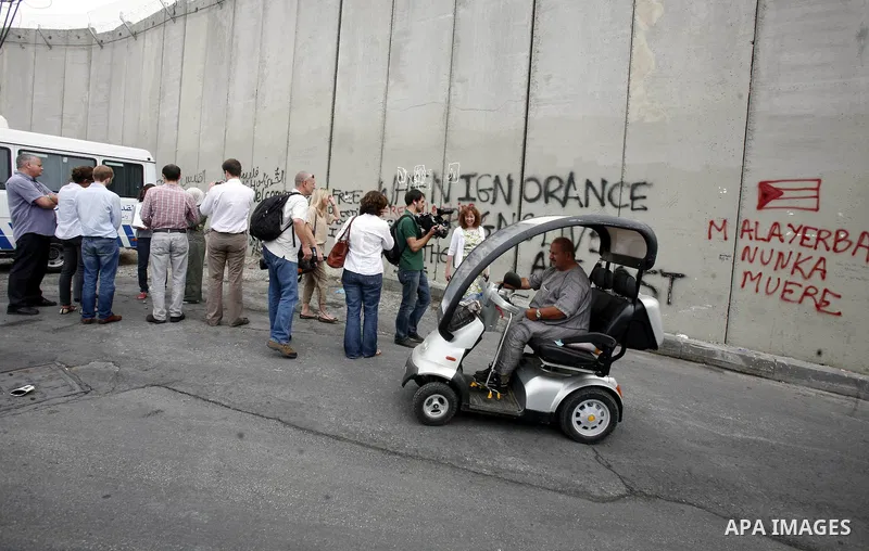 Members of European parliamentary delegation visit visit the separation barrier near Abu Dis in south Jerusalem on october 1, 2012. Photo by Mahfouz Abu Turk