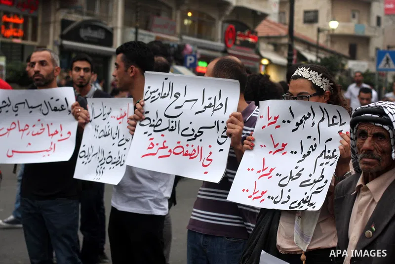 Palestinian protesters from the West Bank town of Ramallah, march towards the Palestinian Presidential compound as they hold slogans against the Palestinian Authority security forces, in Ramallah, West Bank, 02 October 2...
