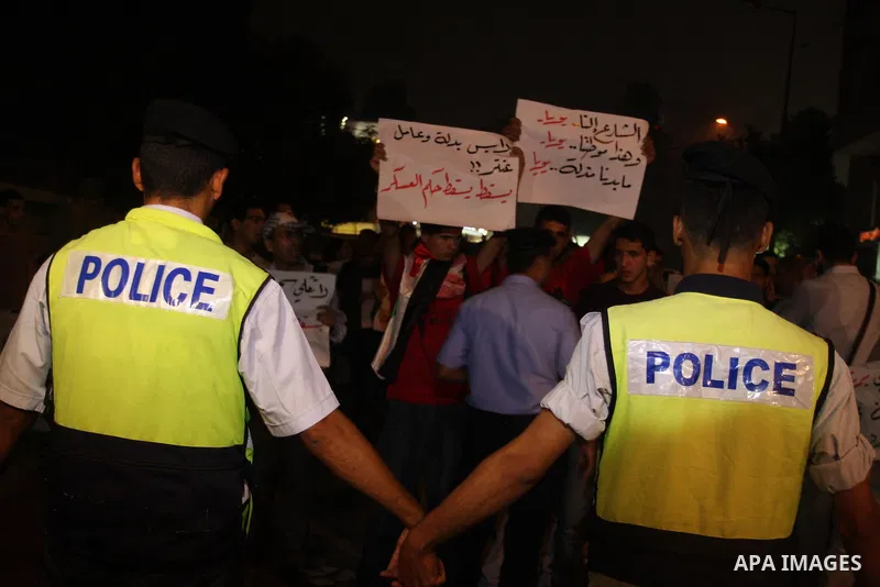 Palestinian police block protesters from marching toward the Palestinian Presidential compound the West Bank town of Ramallah, 02 October 2012, as they hold slogans against the Palestinian Authority security forces. Demo...
