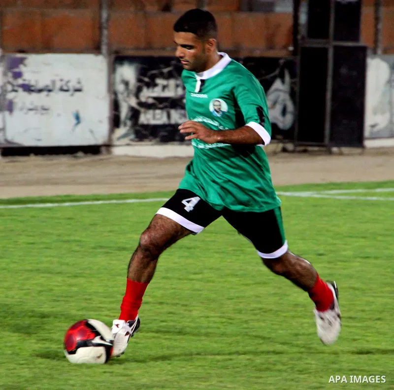 Mahmud Sarsak, Palestinian football player, plays with the team of al-Shijaia and Rafah Youth Club, in Yarmouk Stadium in Gaza city, on Oct. 02, 2012. Photo by Alaa Shamaly