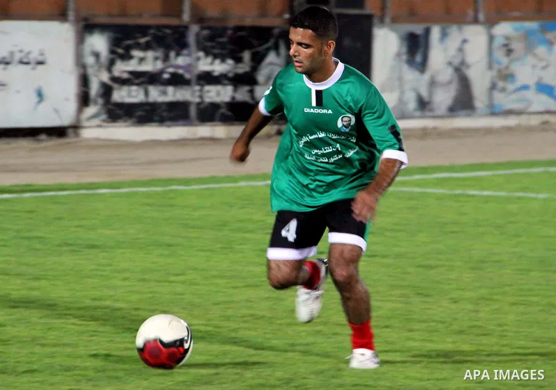 Mahmud Sarsak, Palestinian football player, plays with the team of al-Shijaia and Rafah Youth Club, in Yarmouk Stadium in Gaza city, on Oct. 02, 2012. Photo by Alaa Shamaly