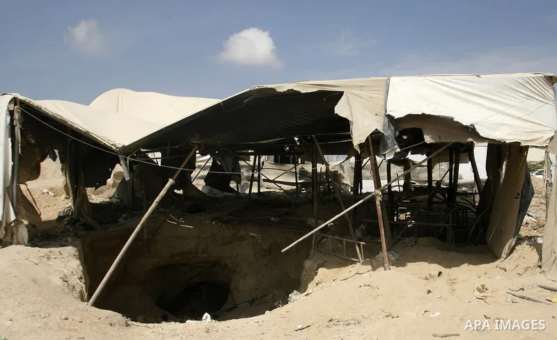 Palestinians work at smuggling tunnels along the border with Egypt in Rafah, southern Gaza Strip, on Oct. 04, 2012. Since last month, Egyptian military have destroyed about 30 tunnels and blocked more which were used for...